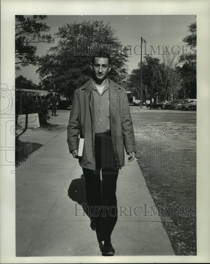 1964 Sidney Glasser, a college student on his way to class - Historic Images