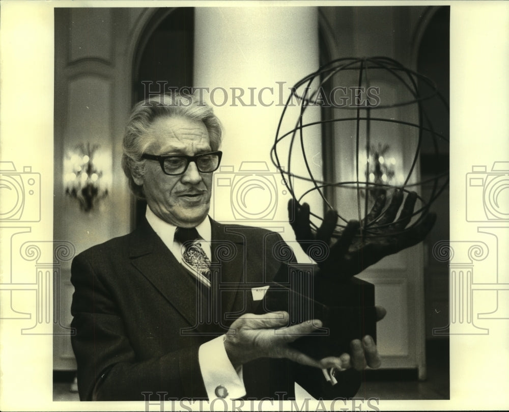 1979 Press Photo Frederick J. Gisevius Jr. holds up a sculpture - nob25476 - Historic Images