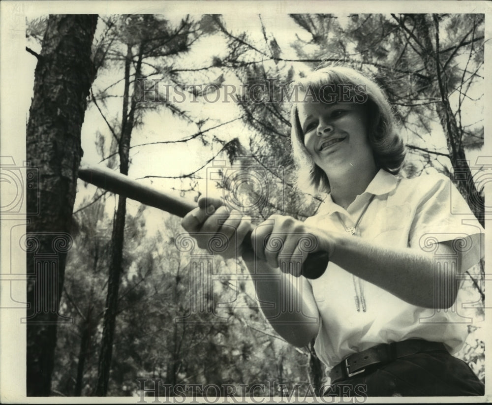 1966 Phyllis Pinkerton gets feel of hatchet at Camp Iti Kana - Historic Images