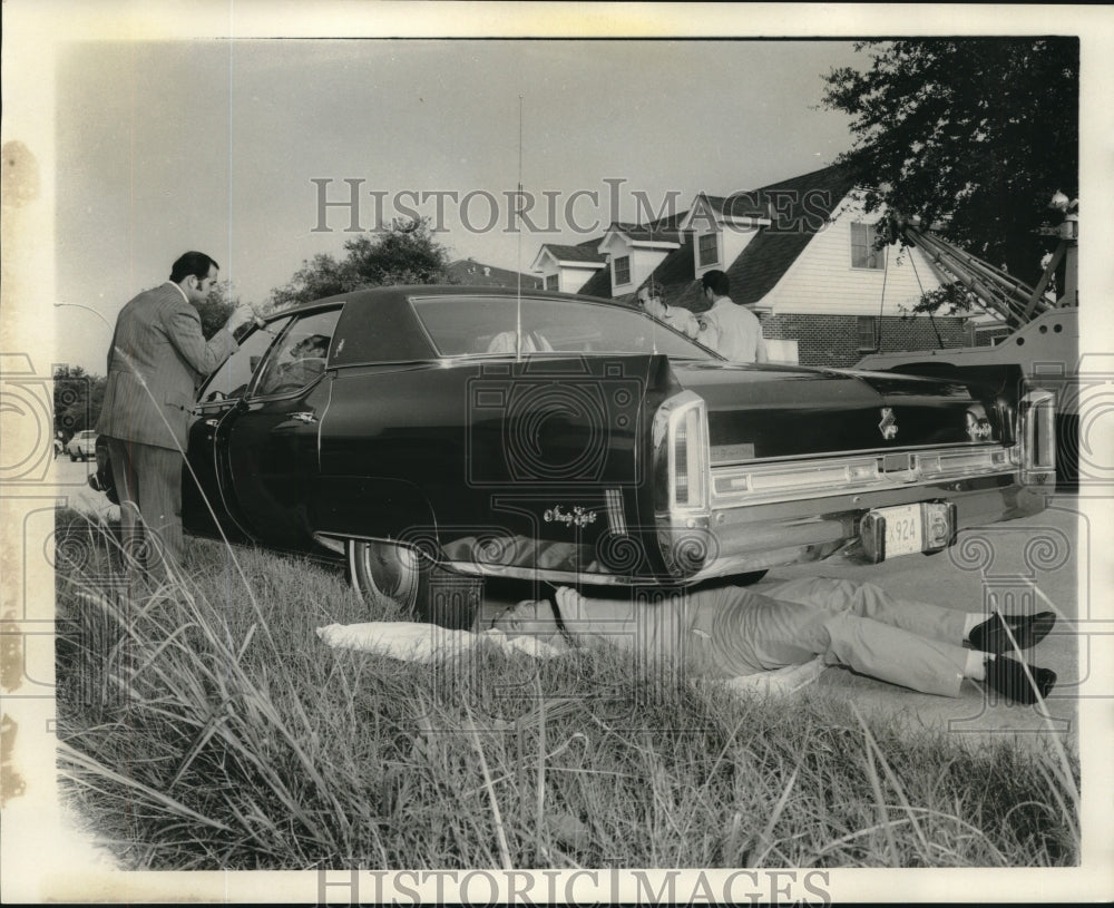 1973 Press Photo Clarence Giarrusso inspects stolen auto - nob26737 - Historic Images