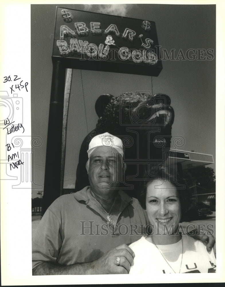 1993 Press Photo A.C. Hebert and daughter Debra in front of their store sign - Historic Images