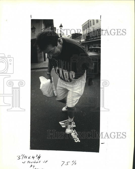1992 Press Photo Here George Skagerberg from Chicago stomps on a Saints Banner. - Historic Images