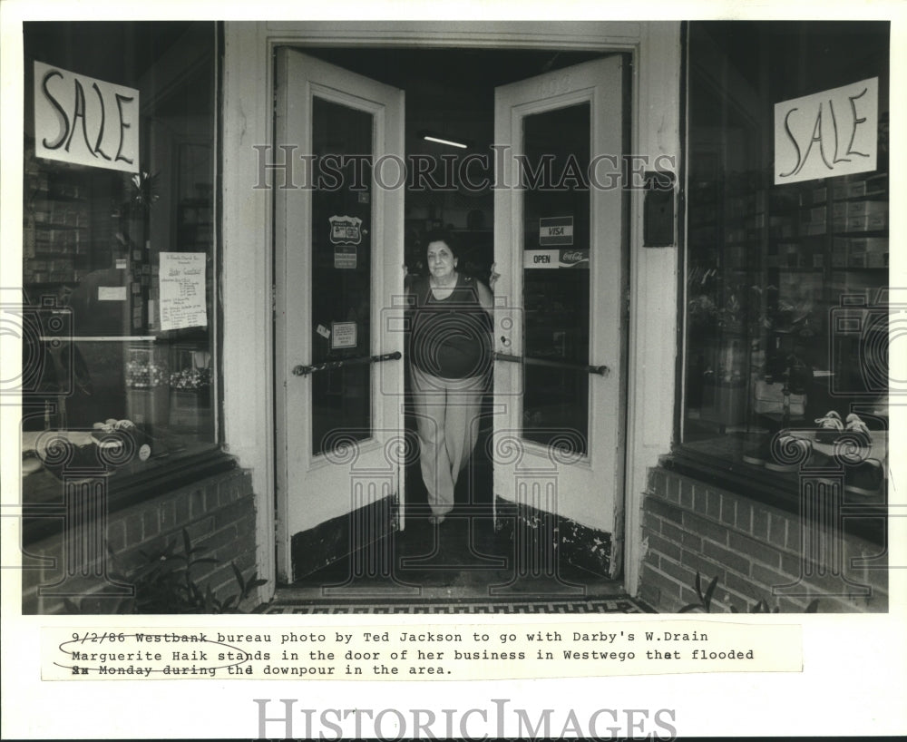 1986 Press Photo Marguerite Haik stands in the door of her business, Westwego - Historic Images