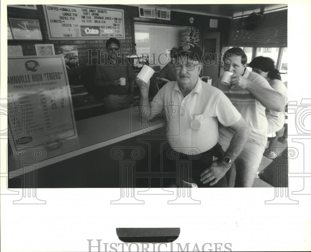 1992 Take Away Donut customers discuss Hahnville/Destrahan rivalry - Historic Images