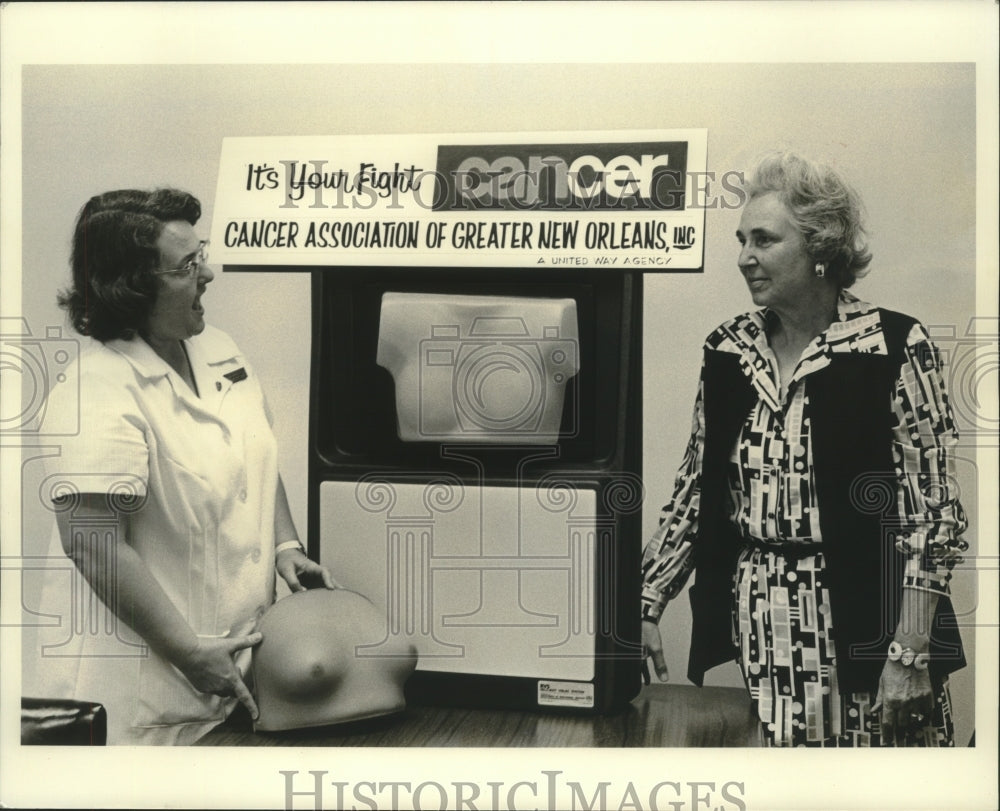 1976 Mary Collins and Evelyn Harsh with the Self-Examination Model. - Historic Images