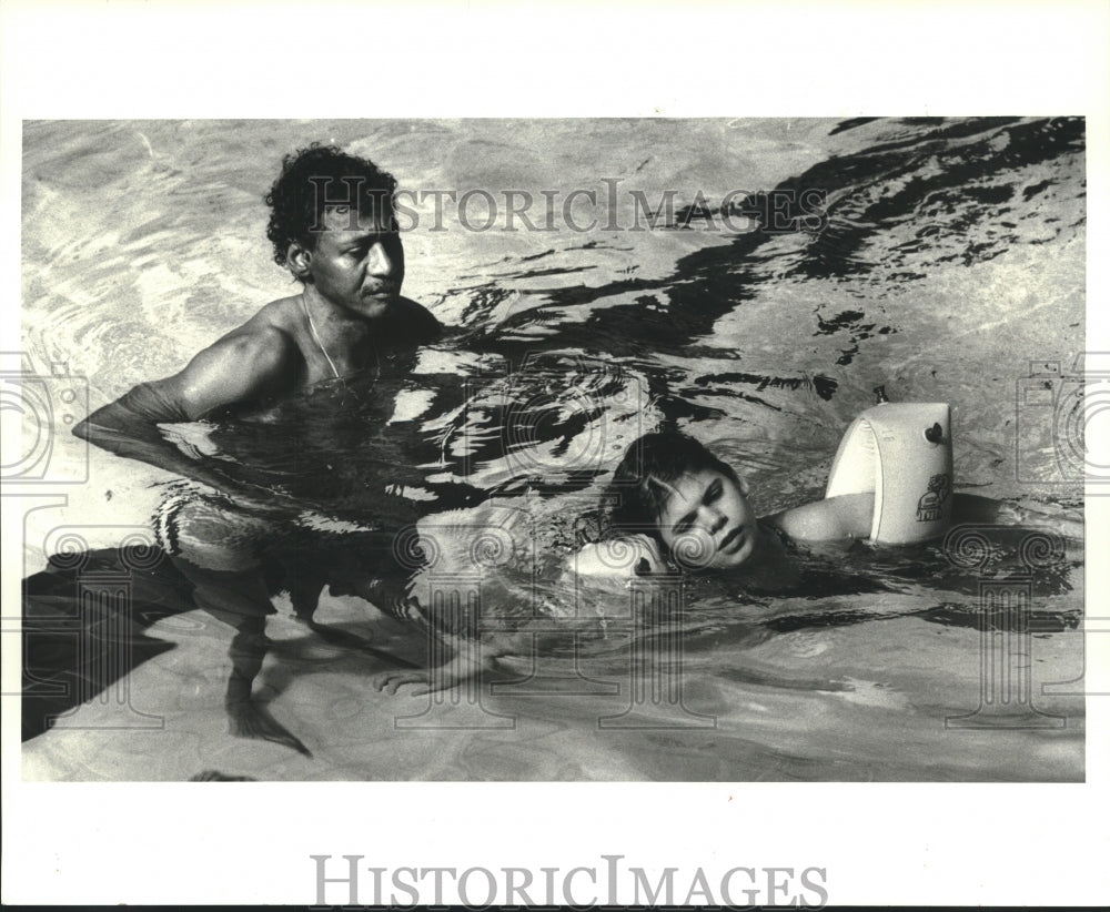 1984 Swim instructor Joseph Gibson and student Stephanie Hiser - Historic Images