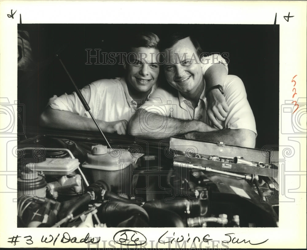 1988 Press Photo Dr. Lee Happel shares a common love for cars with his son Kyle - Historic Images