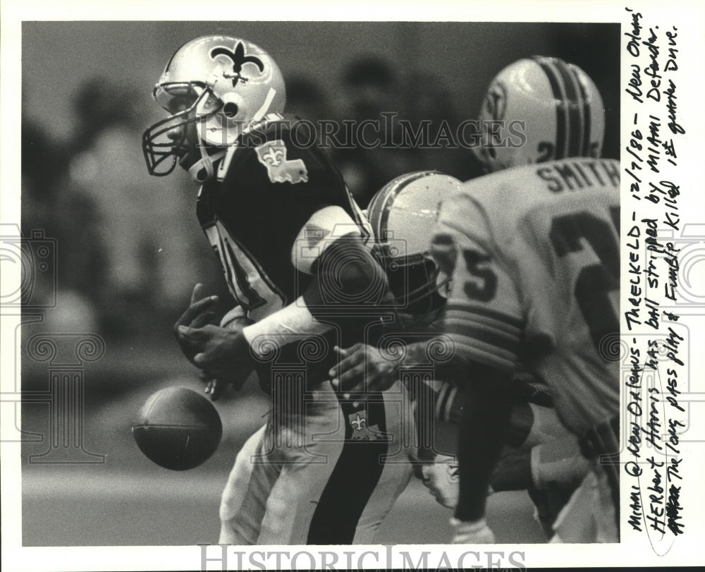 1986 New Orleans Herbert Harris has ball stripped by Miami Defender - Historic Images