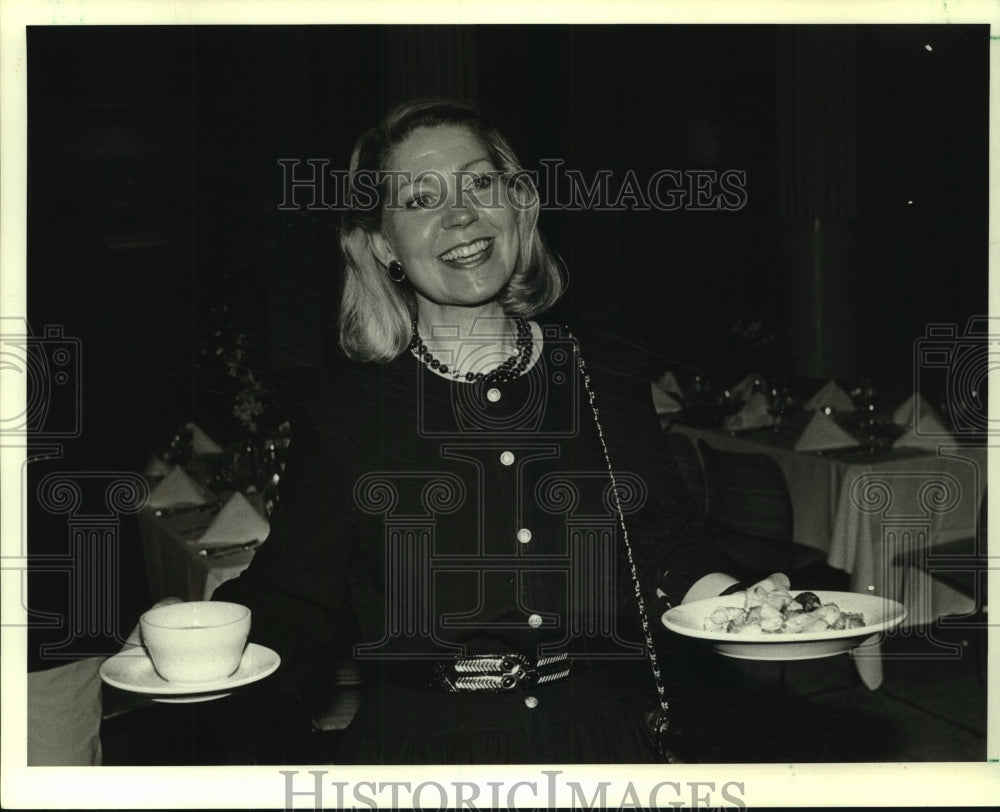 1988 Store manager Linda Herold at a social event - Historic Images