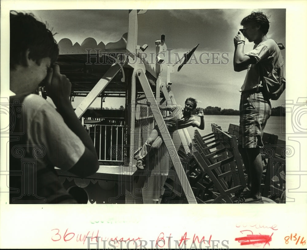 1988 Student Thomas Hevizi clowns for a picture on a paddle wheeler. - Historic Images