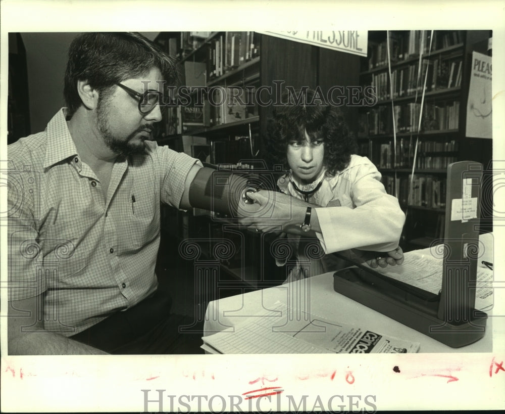 1986 Robert Beadle gets blood pressure checked during Health Fair - Historic Images