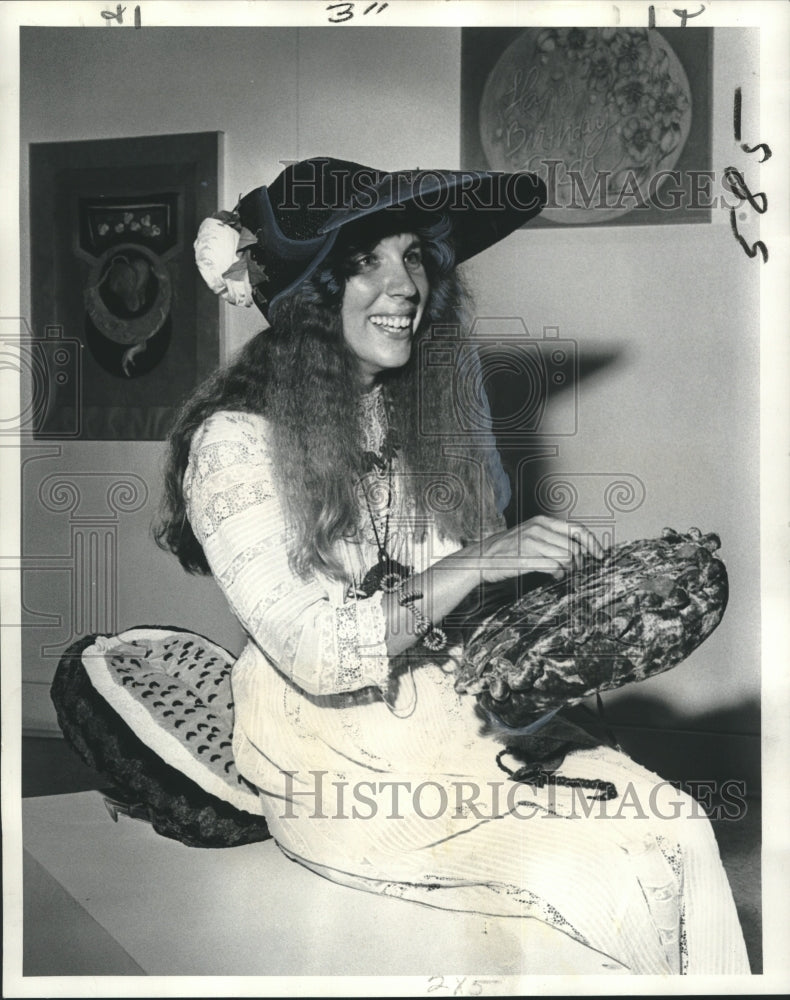 1974 Press Photo Artist Suzanne Zimmerman picks cherry from her pie sculpture-Historic Images