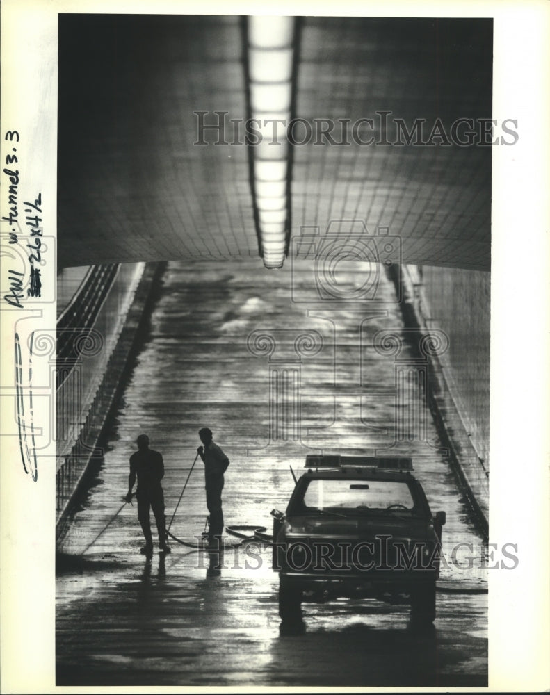 1989 Crews of State Department of Transportation clean Harvey Tunnel - Historic Images