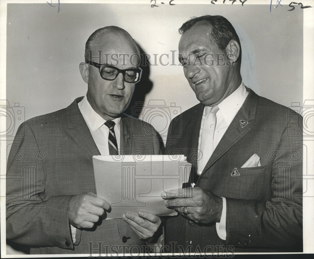 1967 Van W. Hinkle and Frank A. France review their meeting agenda. - Historic Images