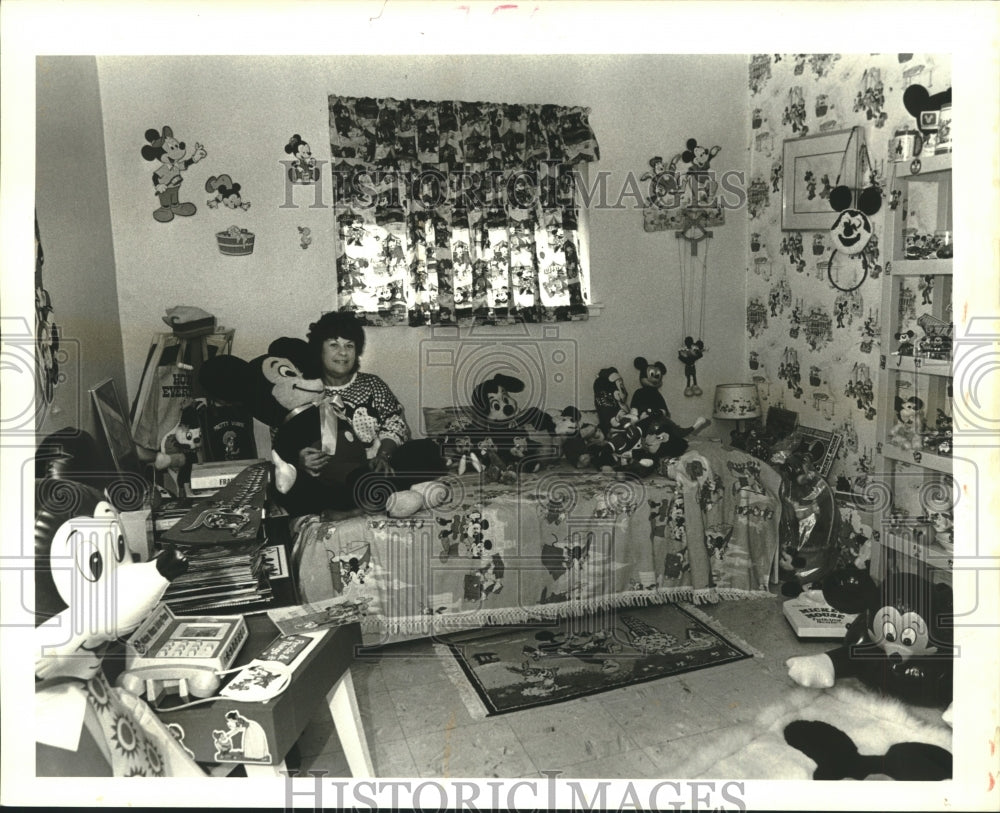 1987 Carroll Holmes sits in Mickey&#39;s Bed  with Mickey Doll - Historic Images