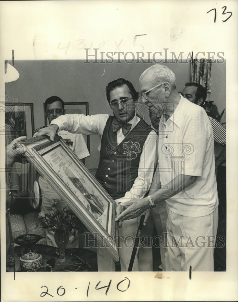 1977 Rep. F. Edward Herbert admires plaque awarded for service. - Historic Images