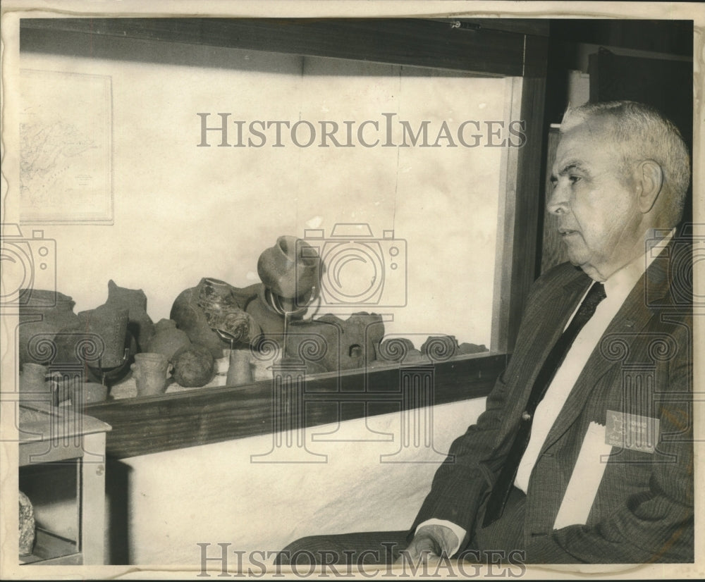 1970 Howard HIllier displays collection of prehistoric pots and urns - Historic Images