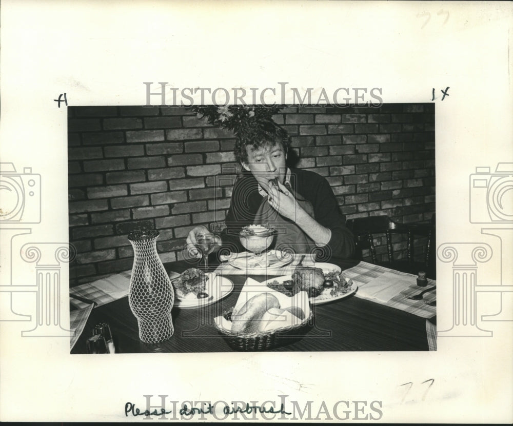 1974 Mark Hemeter, enjoying a Luscious lamb meal at the Royal Oak - Historic Images