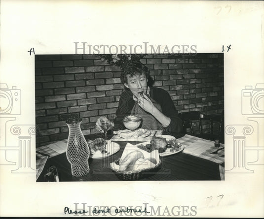 1974 Mark Hemeter, enjoying a Luscious lamb meal at the Royal Oak - Historic Images
