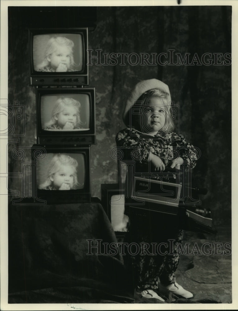 1990 Press Photo A toddler holding a Home Video Camera - Historic Images