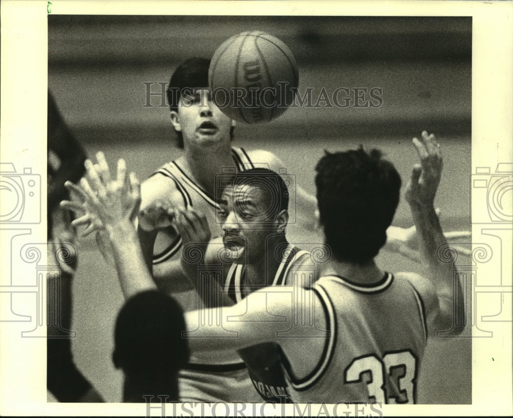 1988 McDonough&#39;s Marcus Jones and Holy Cross&#39; John Costello in game. - Historic Images