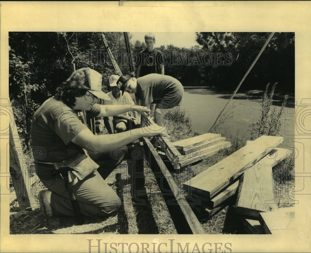 1990 Press Photo Workmen constructing walkway for for Honey Island Swamp boats - Historic Images