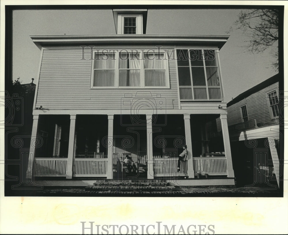 1983 Press Photo Two children sitting on their front porch of their house - Historic Images