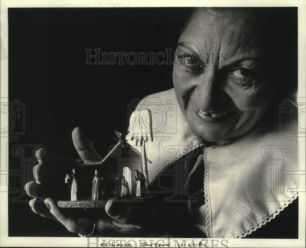 1984 Lilia Hubbard holds one of items she has carved - Historic Images