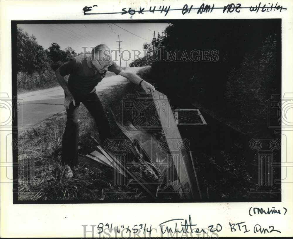 1992 George Manteris Inspects Litter on Howze Beach Road, Slidell - Historic Images