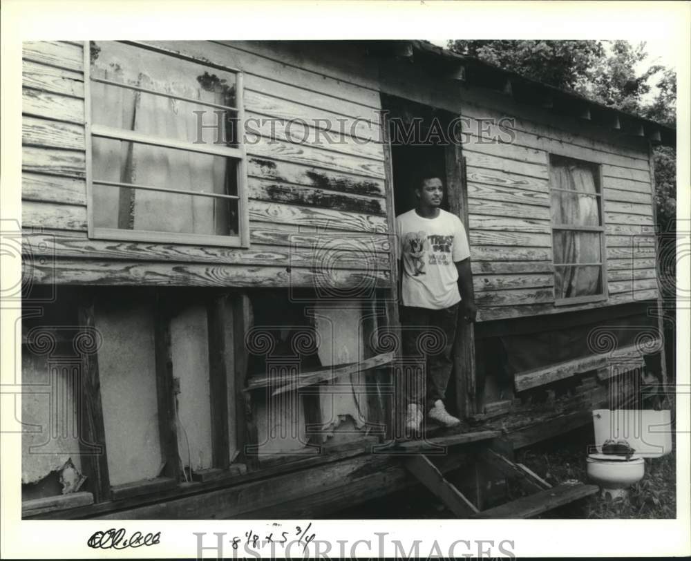 1991 Housing - James Alveris at his substandard house in East Bank - Historic Images