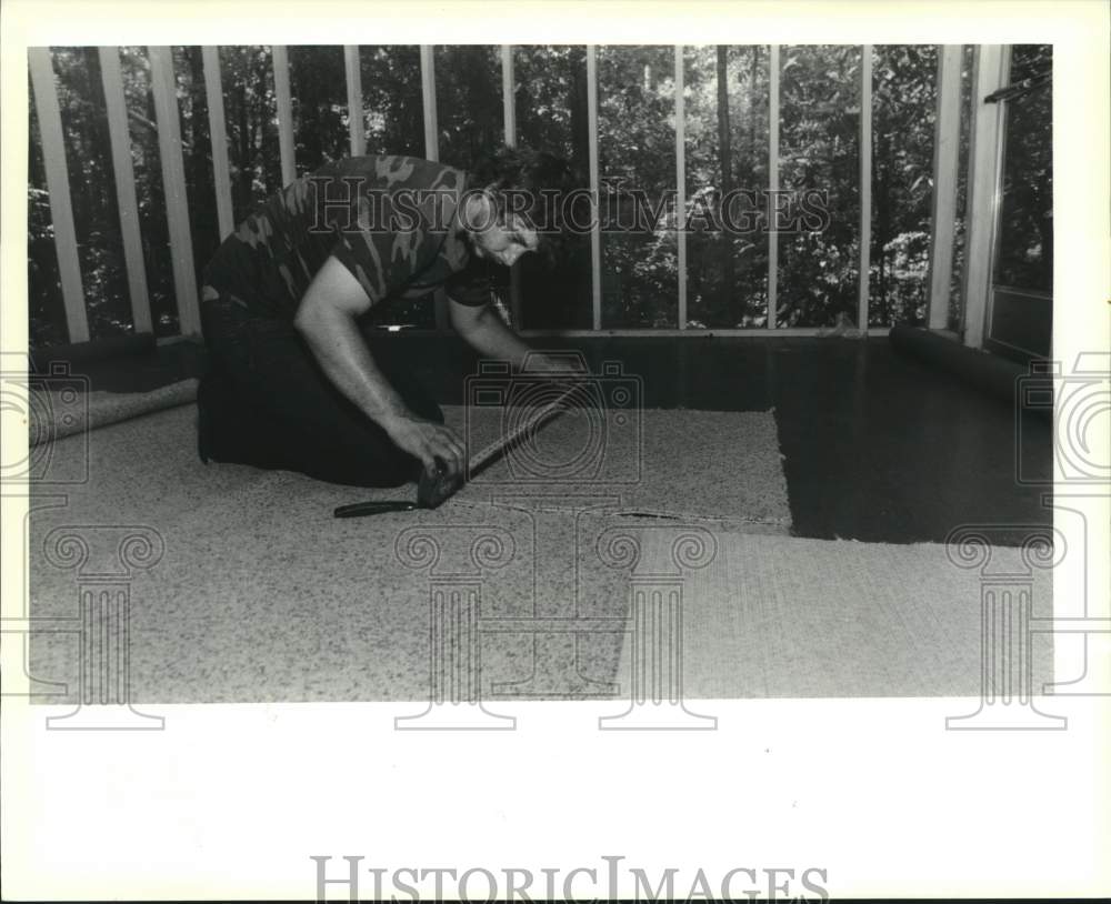 1990 Carpeting - Charlie Holiday measures carpet for the stairs - Historic Images