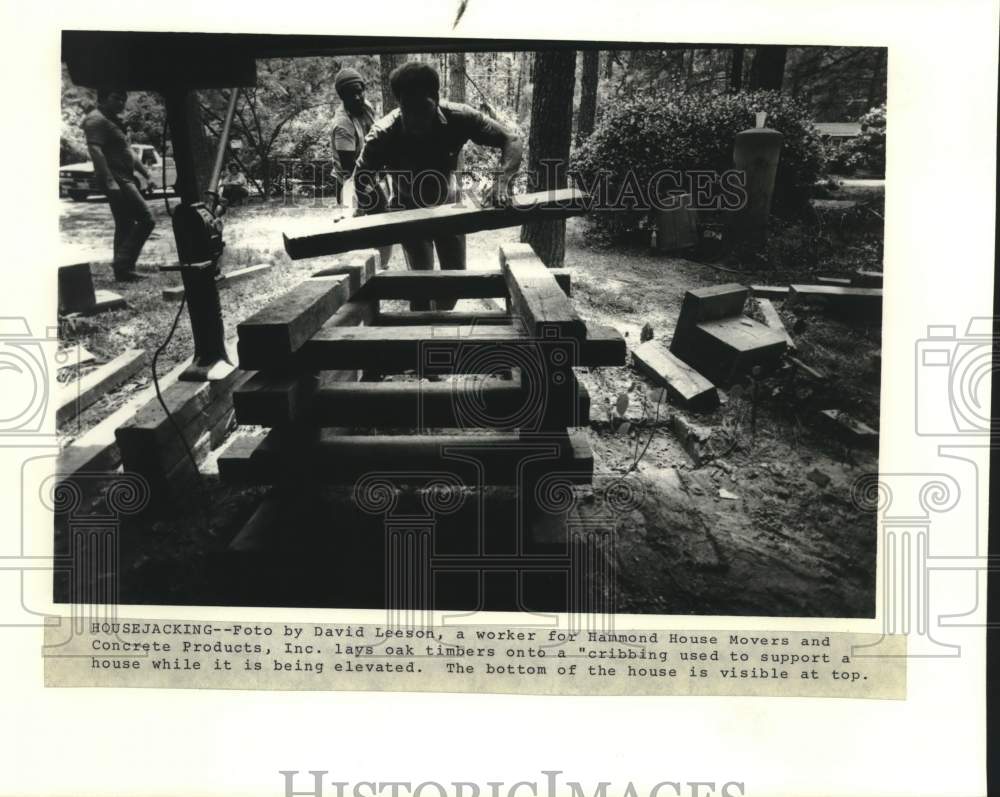 1983 Housing - Hammond House Movers workers lays oak timbers - Historic Images