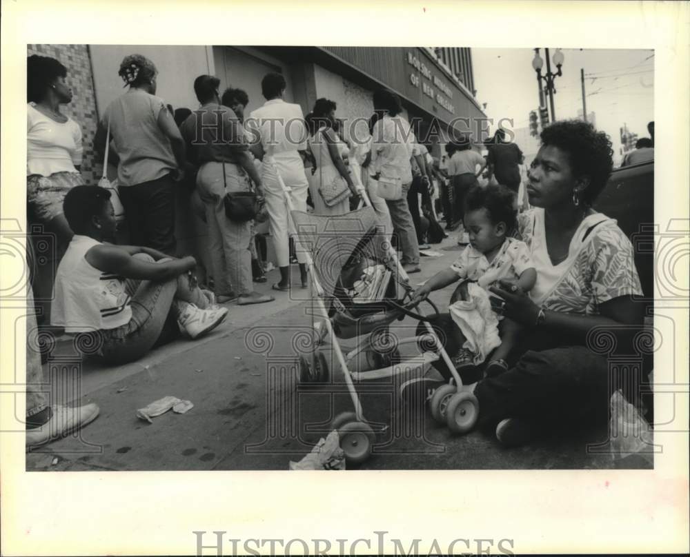 1988 Mary Battle waits in line to apply for public housing at HANO - Historic Images