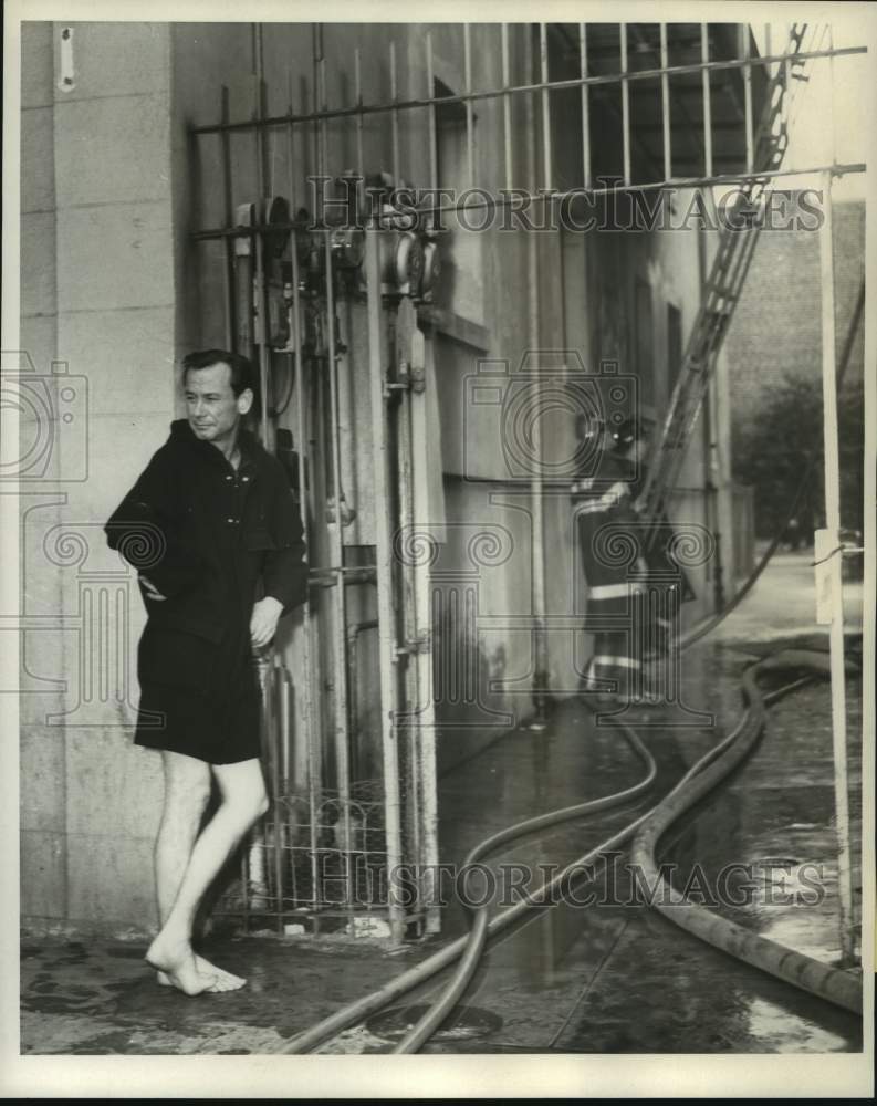 1968 Howard E. Hill waits for firemen so he can get through - Historic Images