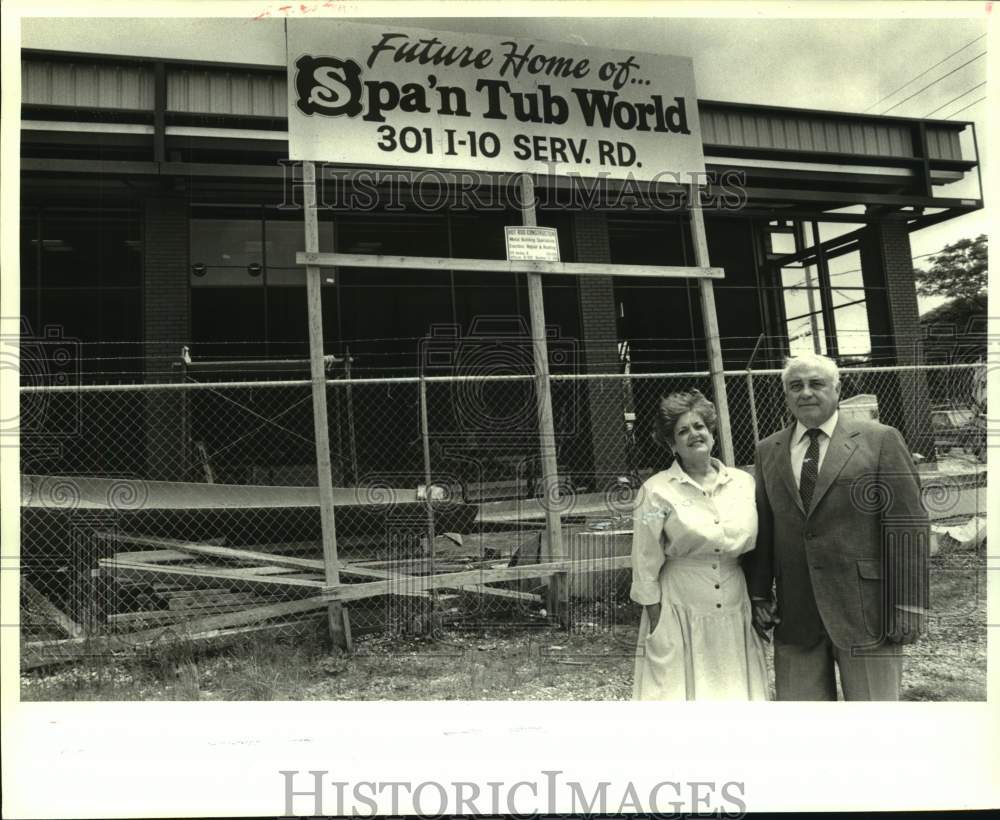 1987 George &amp; Taci Hunter in front of their Spa N Tub World building - Historic Images