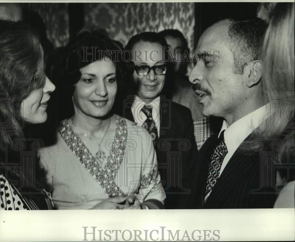 1976 Hussein talks to people - Historic Images