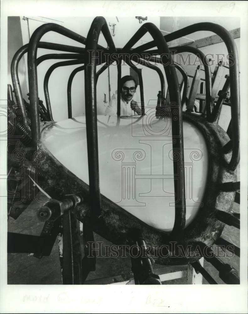 1978 Sam Cardona installs a spider-like mold at PPG Industries plant - Historic Images