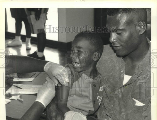 1993 Press Photo James Irving getting immunization shot at The Immuno Fair '93 - Historic Images