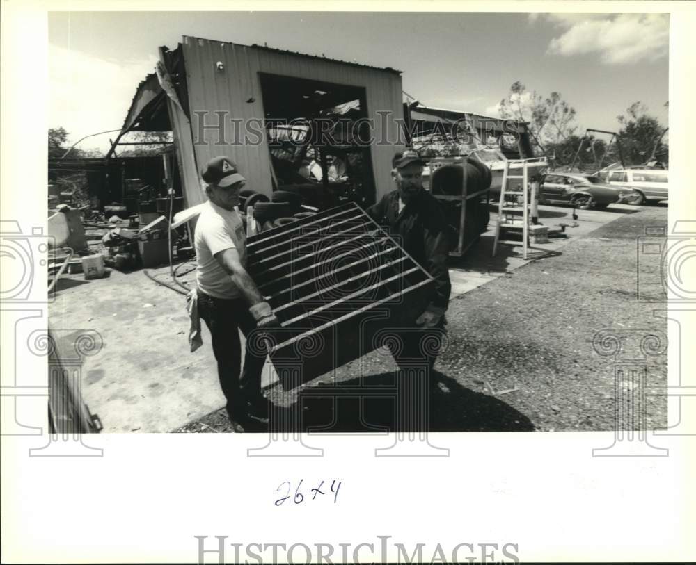 1993 Press Photo Tony Oliveri and Jerry Jacob clean up after a tornado - Historic Images