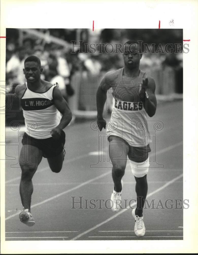 1992 Press Photo Shaw&#39;s Carlos Jones beats Lamark Brim - Jesuit High Track Meet. - Historic Images