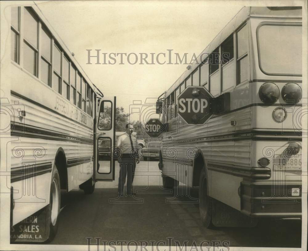 1969 West Bank transportation director Lou Blanda shows a new sign - Historic Images