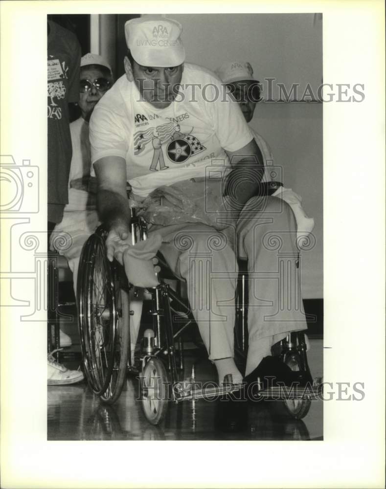 1990 Press Photo Norman Hebert competing at the annual Jr.-Sr. Olympic Games - Historic Images