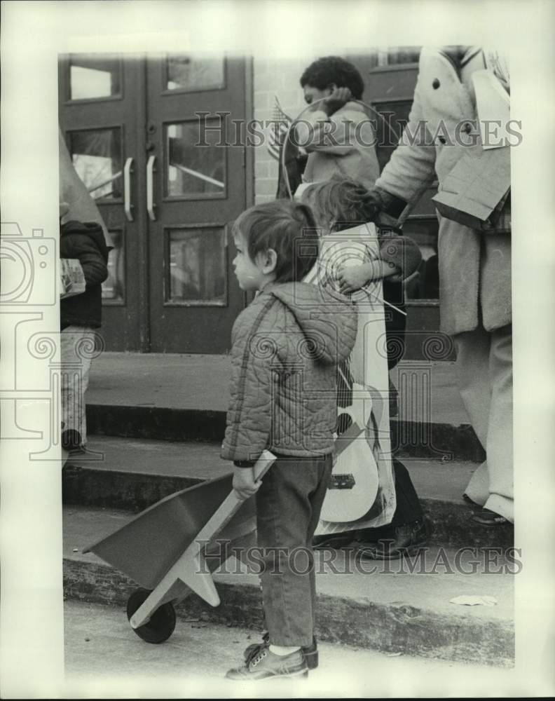 1975 Press Photo Child with wheelbarrow toy - nob43259 - Historic Images