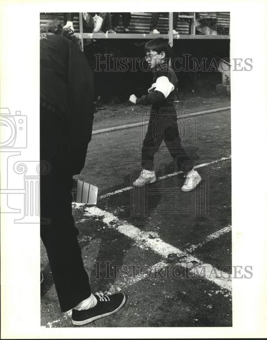 1992 Press Photo  Joshua Keller crosses the finish line at Chalmette Stadium. - Historic Images