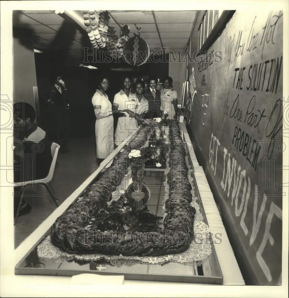 Press Photo A social service luncheon with a sandwich the length of the table. - Historic Images