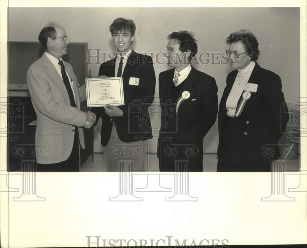 1988 Press Photo Gary Kueber, first-place award in the French Speaking Contest. - Historic Images