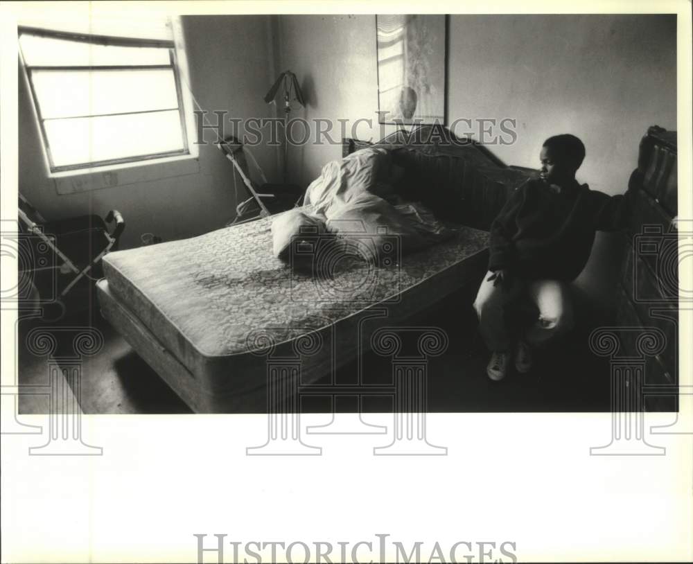 Press Photo A youngster shown at his messy bedroom - Historic Images