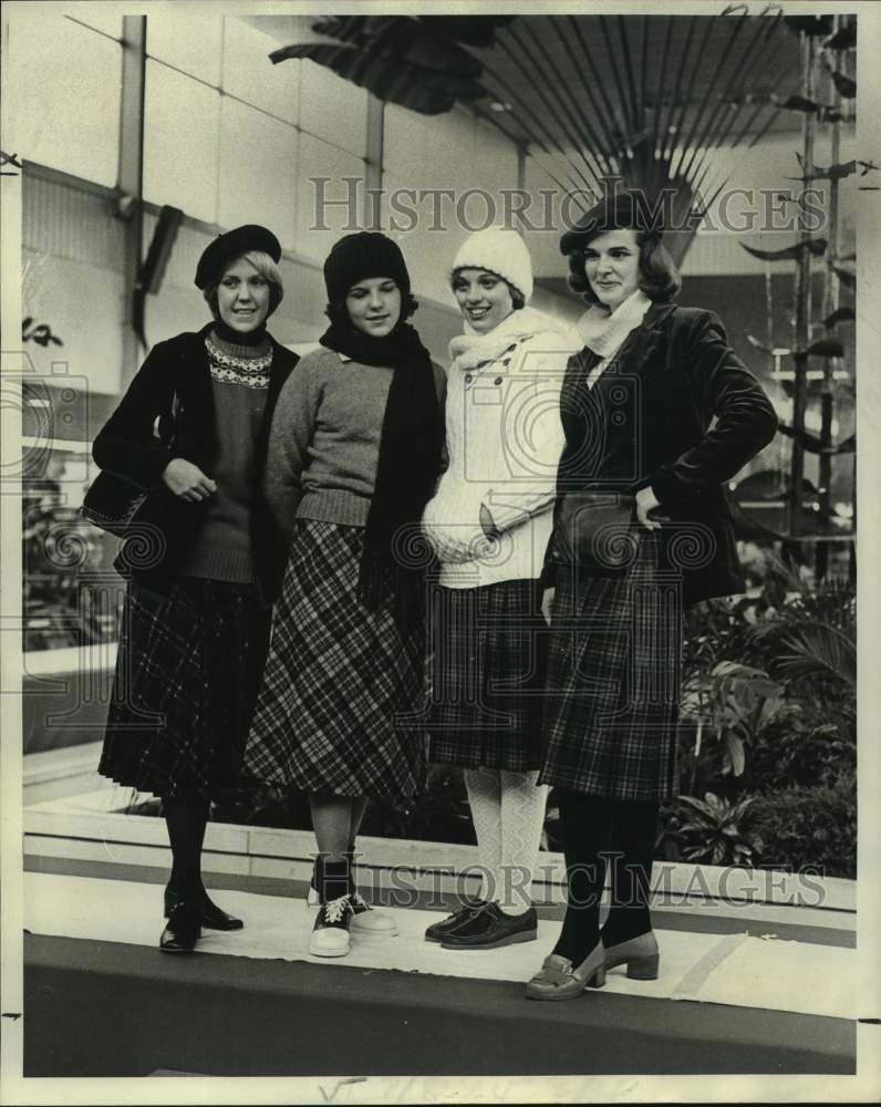 1977 Women wearing kilts topped by sweaters or blazers - Historic Images