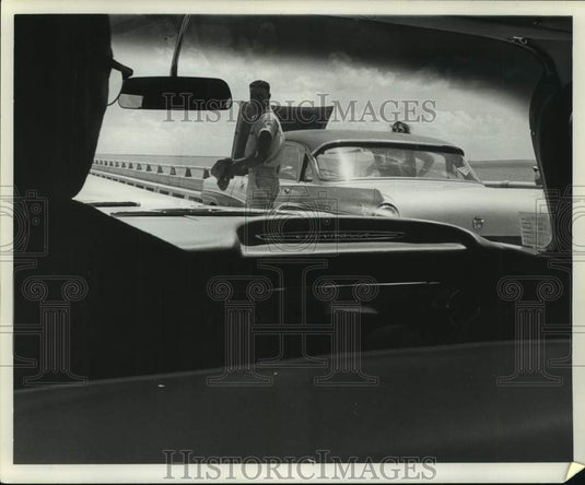 1961 Lake Pontchartrain Causeway police aiding a distressed motorist-Historic Images