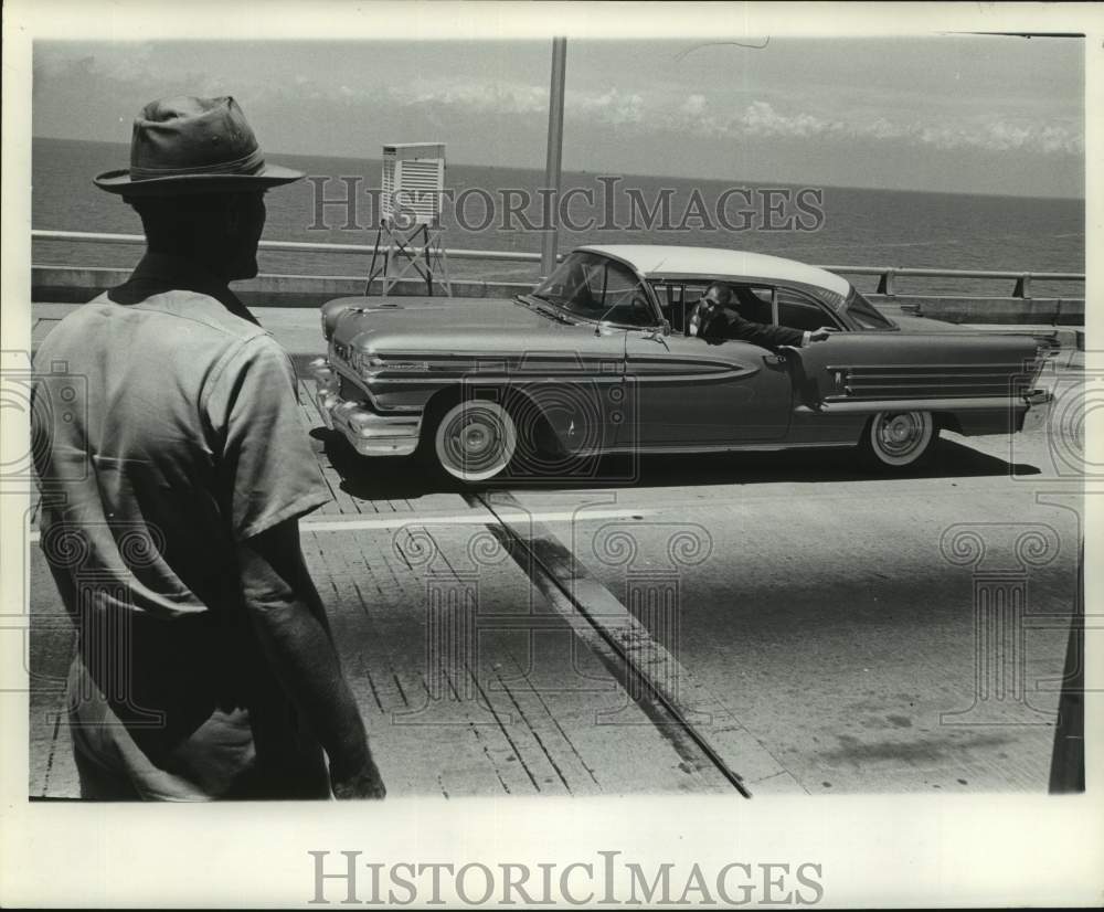 1961 Passing motorist notifies Leo Evans of accident on North Draw - Historic Images